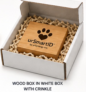 The wood box nested inside a white shipping box with crinkle paper padding